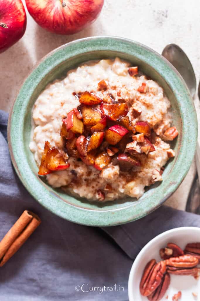 a bowl of apple oatmeal with cinnamon apples