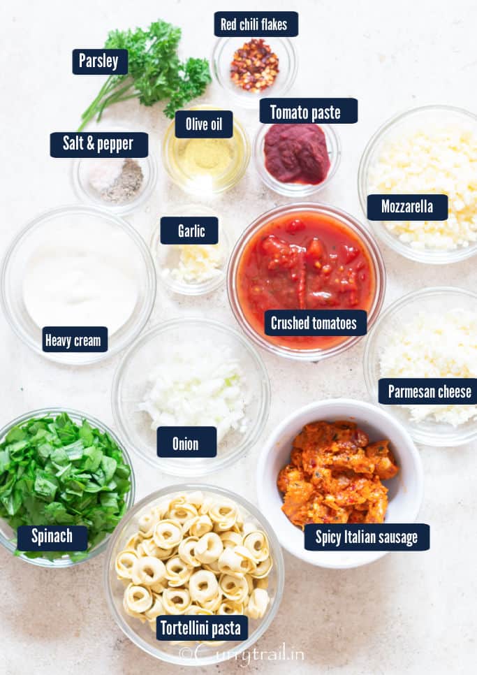 all the ingredients for tortellini casserole placed on a table.