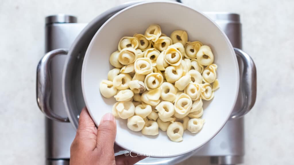 cooked pasta drained into a bowl.