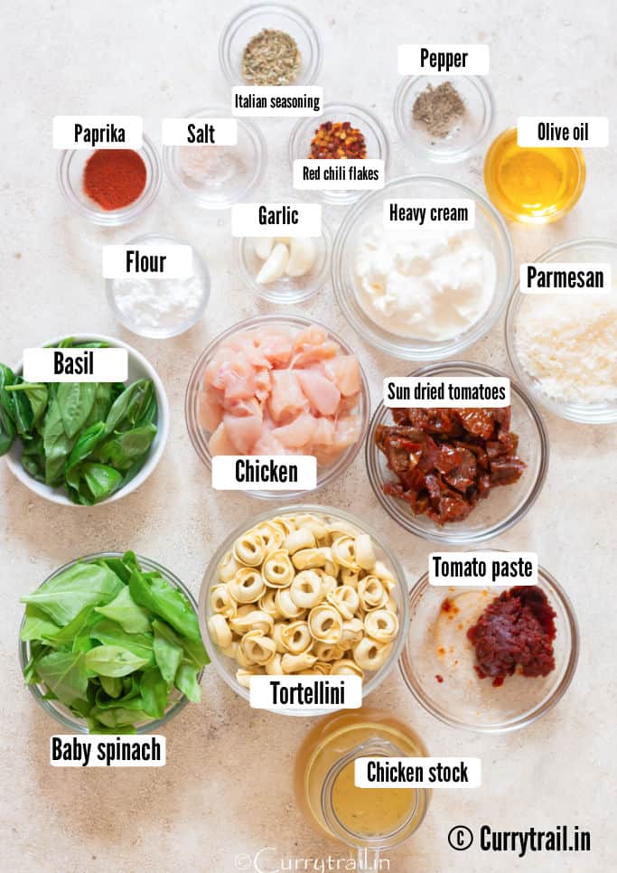 all ingredients for Marry Me chicken with tortellini pasta are arranged on a white table.