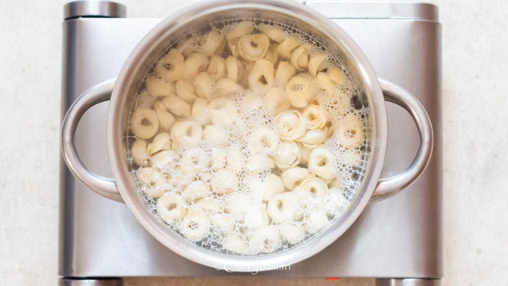 cook tortellini pasta in boiling water.