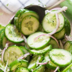 dill and cucumber salad in a bowl.