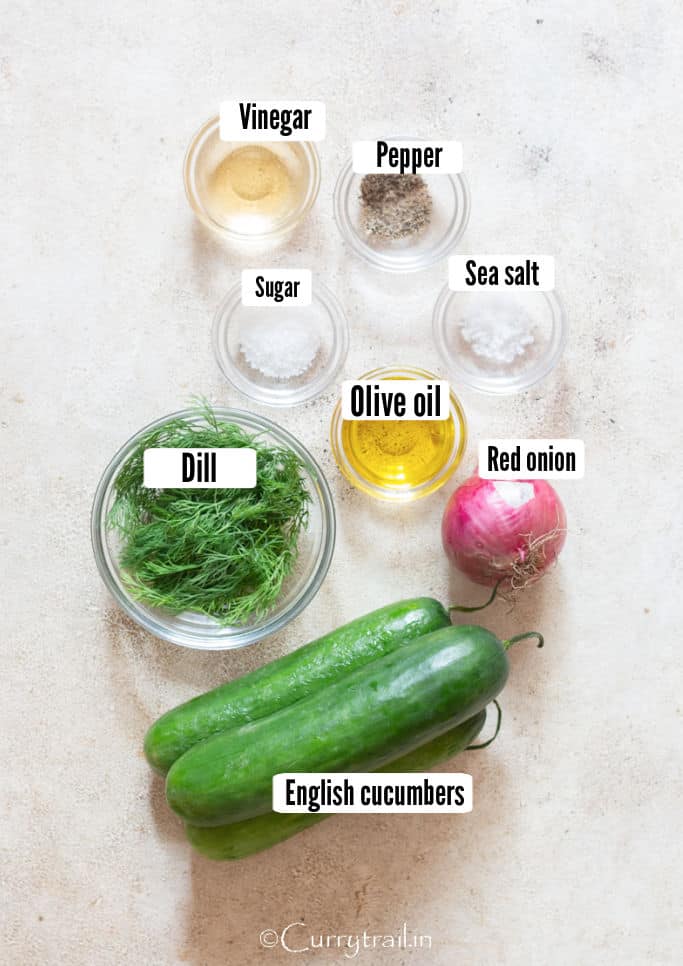 all ingredients for dill and cucumber salad on a table.