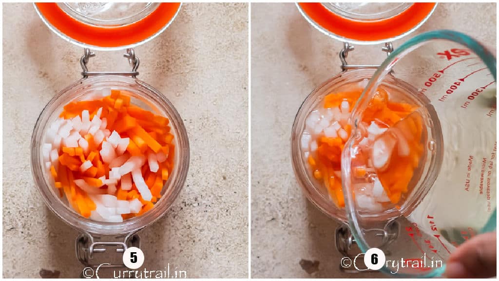 pouring pickling liquid into carrot and daikon matchsticks in a glass jar.