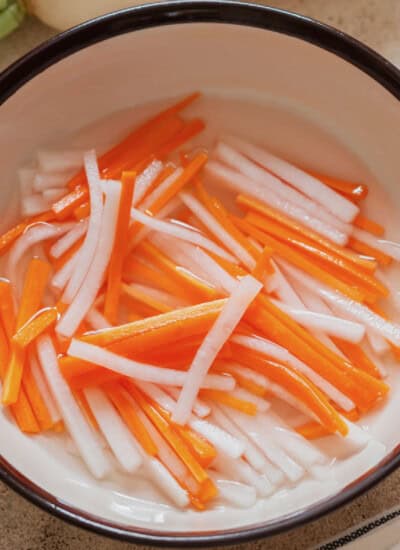 carrot and daikon matchsticks pickled in vinegar.