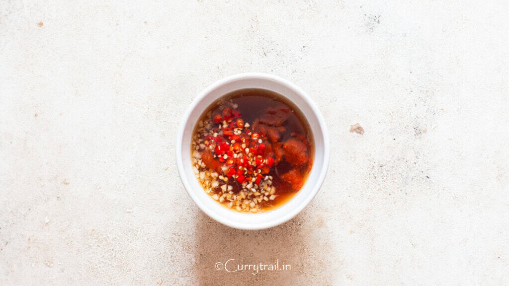 making Vietnamese dipping sauce in a bowl.