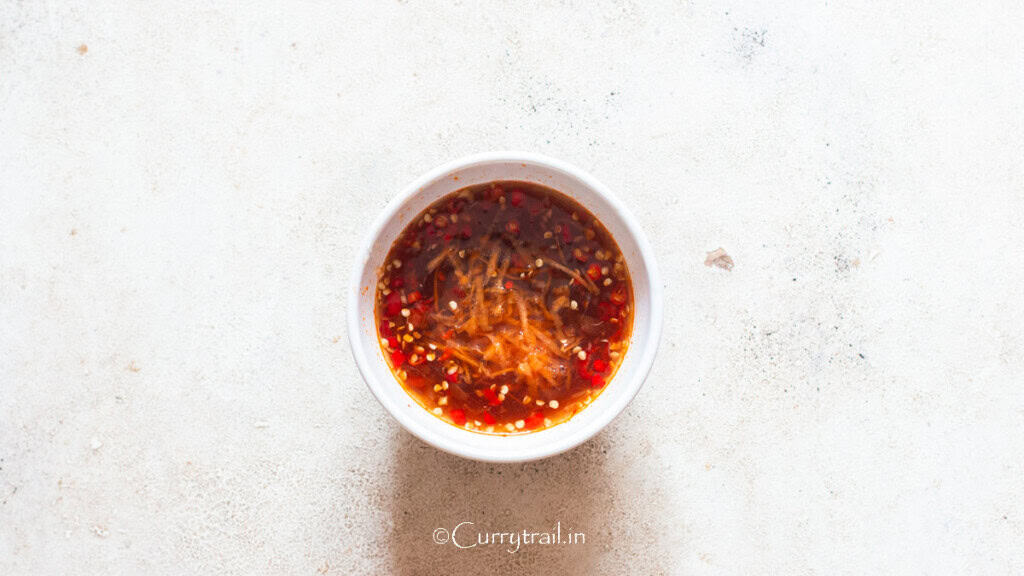 making Vietnamese dipping sauce in a bowl.