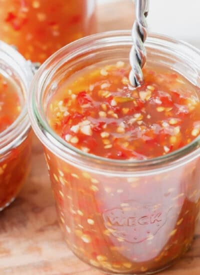 Asian spicy sweet chili sauce in 3 glass jars.