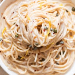 creamy garlic lemon pasta on a plate.