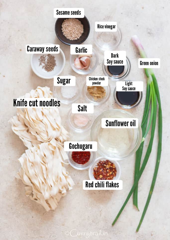 all ingredients for spicy chili oil noodles arranged on the board.
