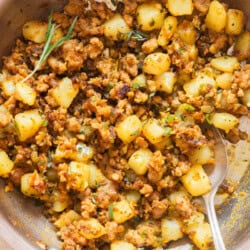 spicy lamb with potatoes cooked in a skillet.