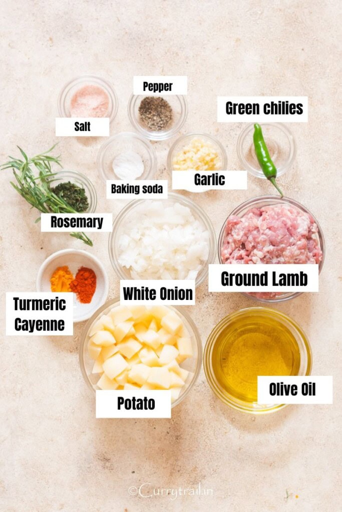 All the ingredients for the spiced ground lamb recipe are arranged on a table.