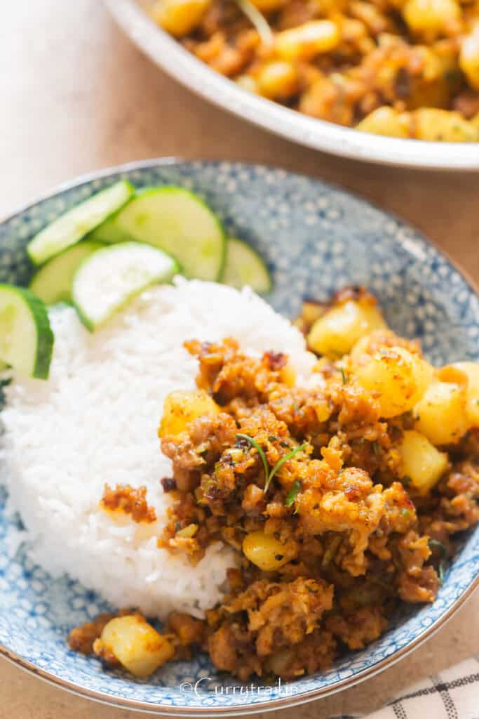 lamb with potatoes served over rice.