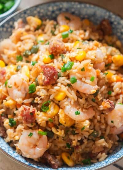 fried rice in a bowl with shrimp, Chinese sausage and eggs.