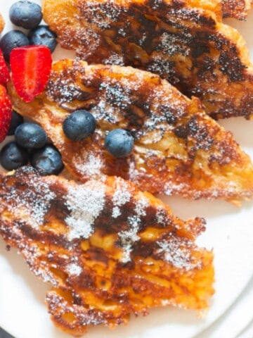 French toast with buttery croissant with fresh berries.