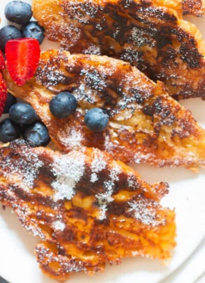 French toast with buttery croissant with fresh berries.