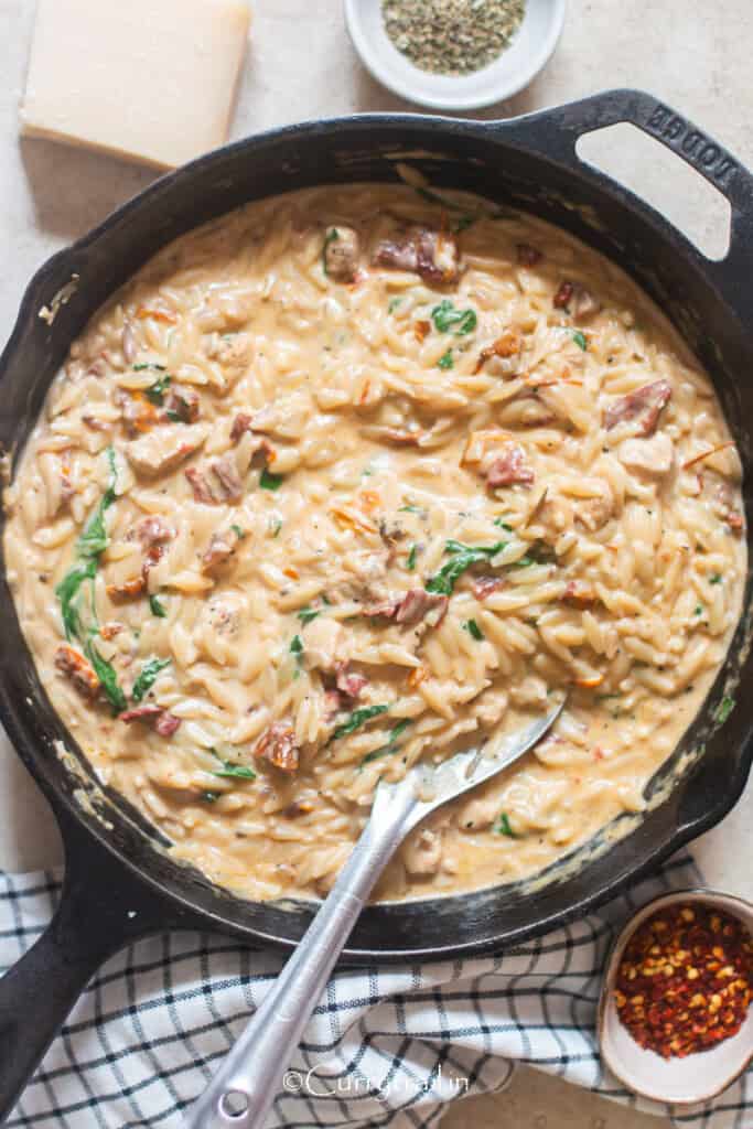 marry me pasta made with orzo in cast iron pan.