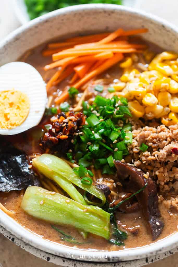 ramen in spicy miso broth with chicken and other toppings.