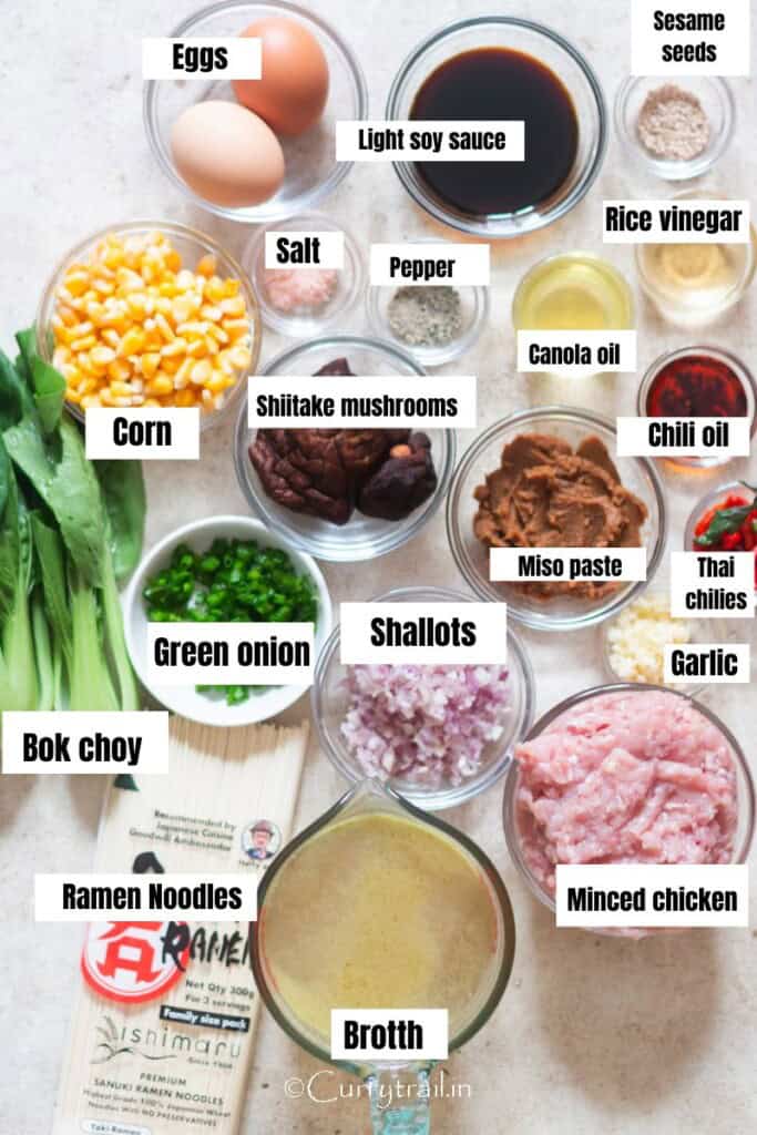 All ingredients for miso ramen with chicken are arranged on a table.