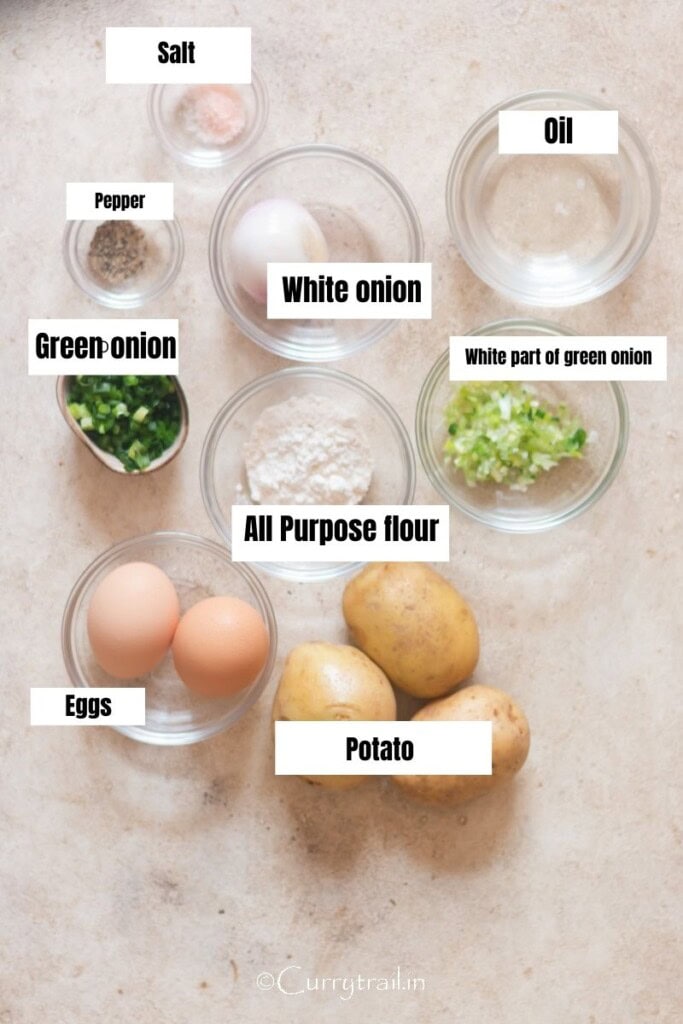 all ingredients for German potato pancakes arranged on a table.