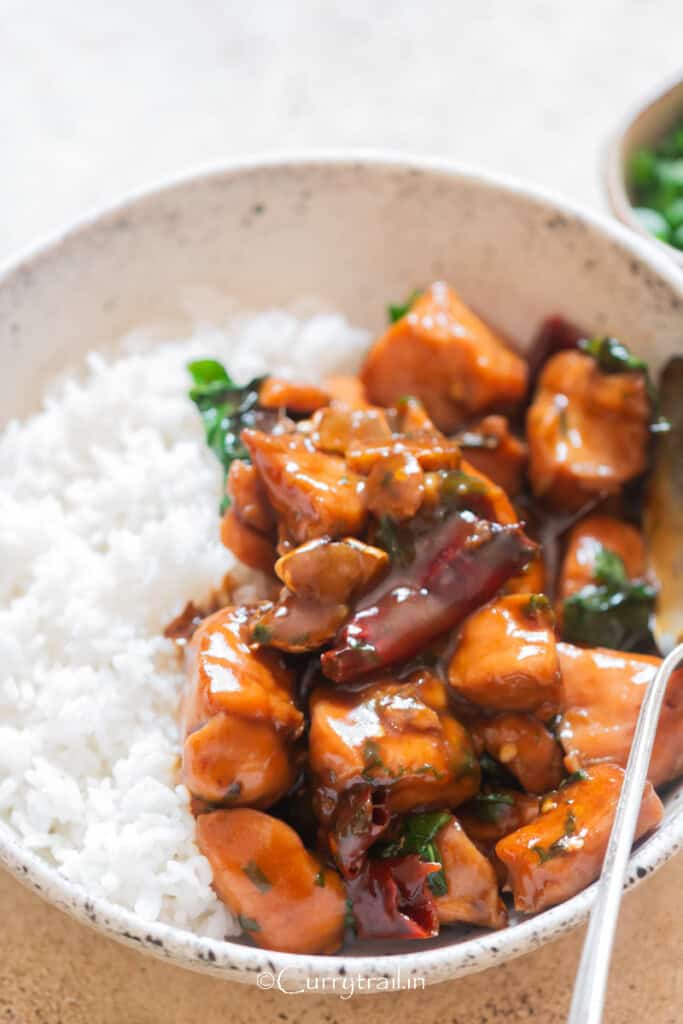 three cup chicken served with jasmine rice.