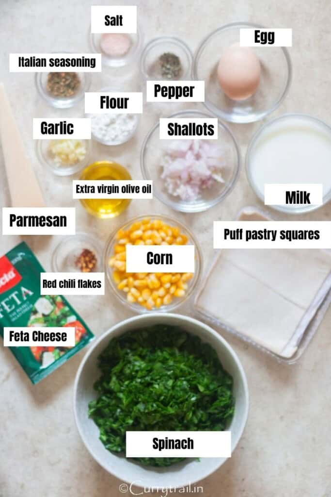 all ingredients for spinach puffs on a table.