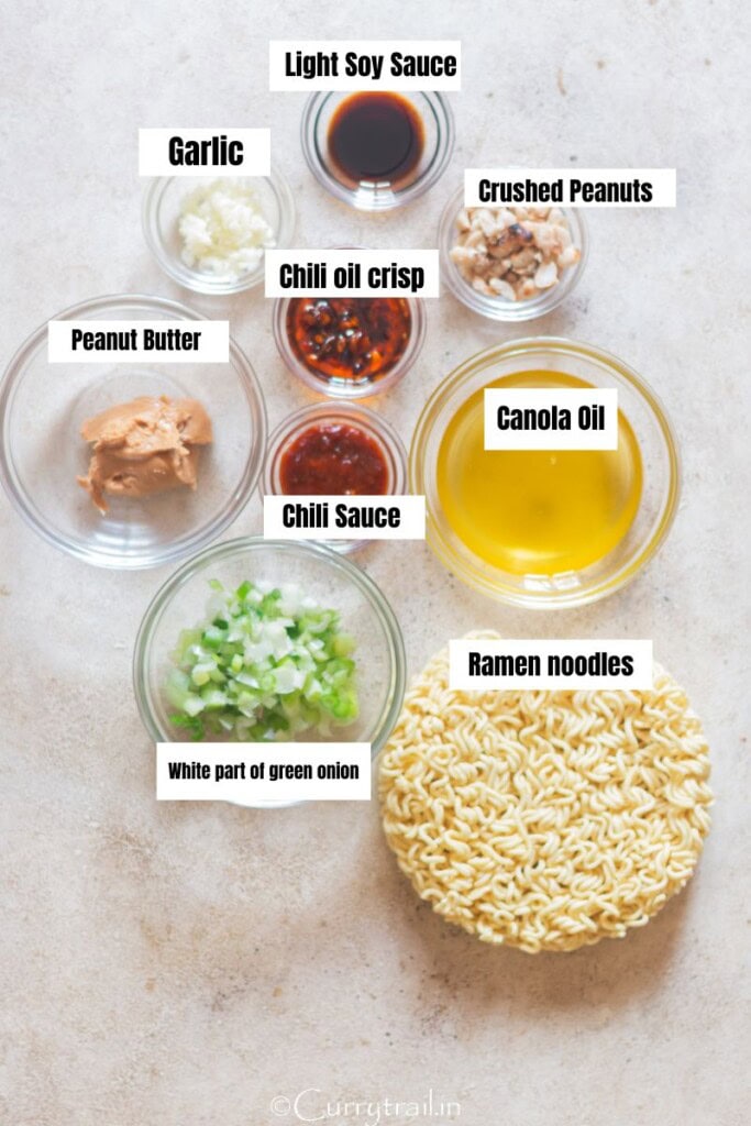 all ingredients for ramen noodles with peanut butter arranged on a table.