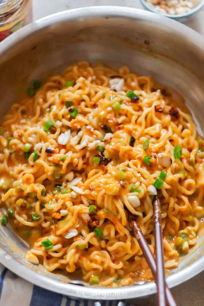 savoury peanut butter ramen noodles in with chili oil and green onions.