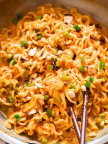 creamy spicy peanut butter ramen noodles cooked in a skillet.