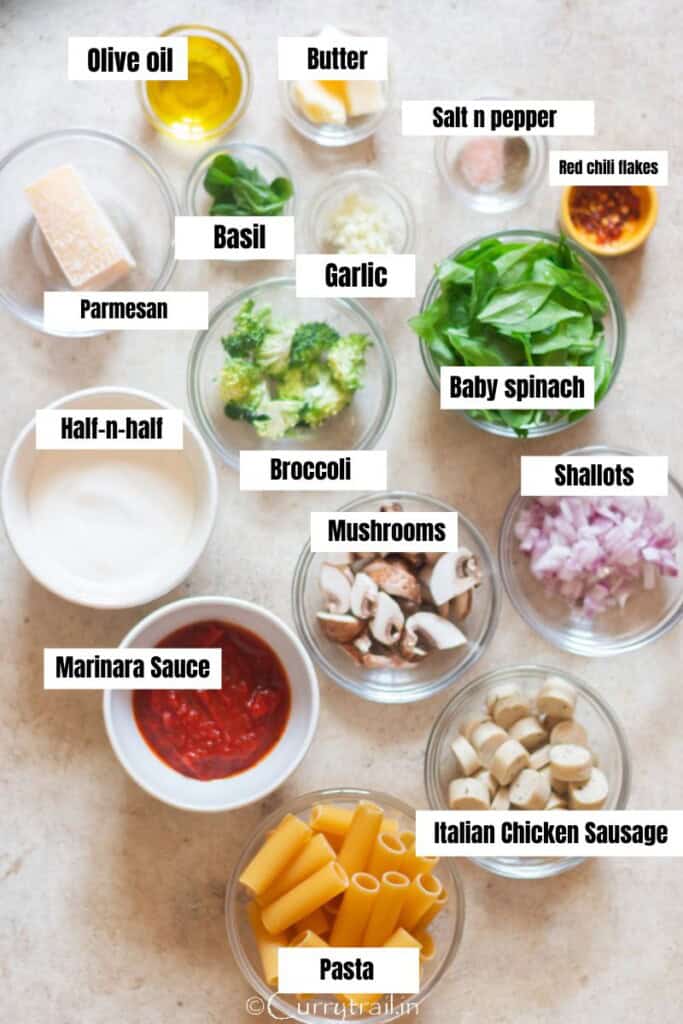 all ingredients for chicken sausage and pasta in tomato sauce.