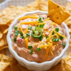 creamy boat dip served with nachos.