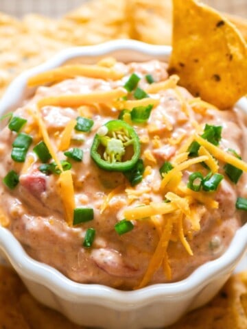 creamy boat dip served with nachos.