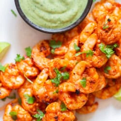 spicy grilled shrimp on bamboo skewers with avocado dip.