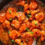 spicy crispy chicken coated in hot sauce.