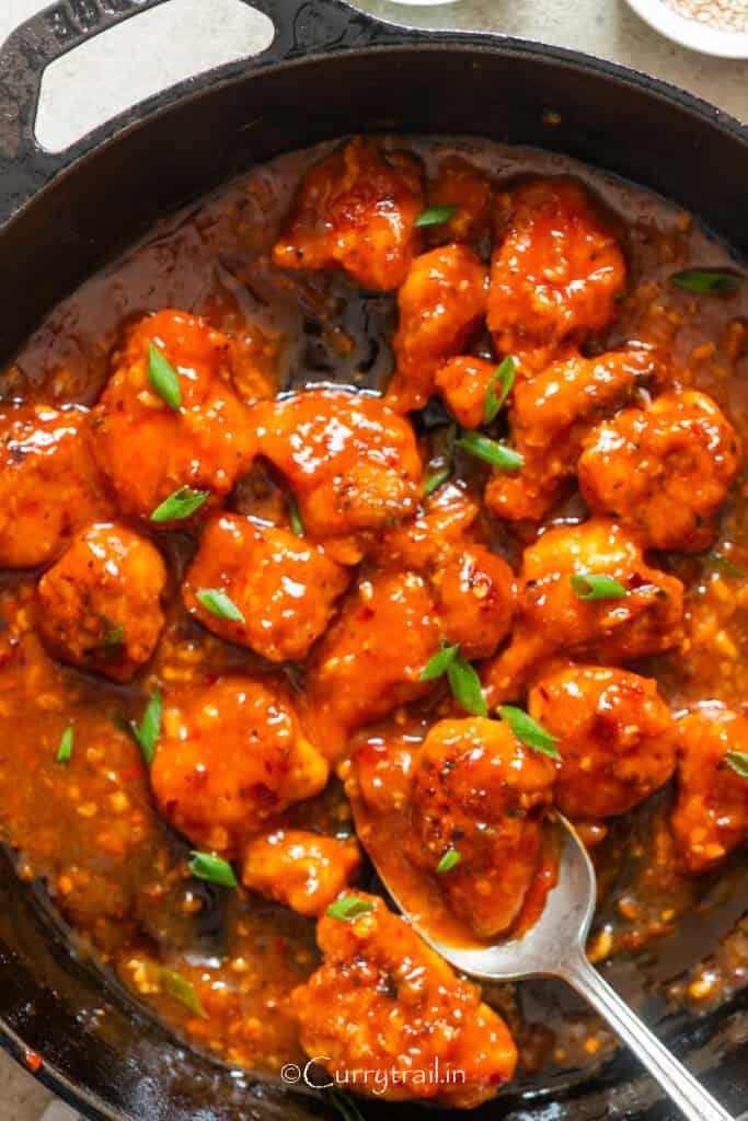 spicy crispy chicken coated in hot sauce.