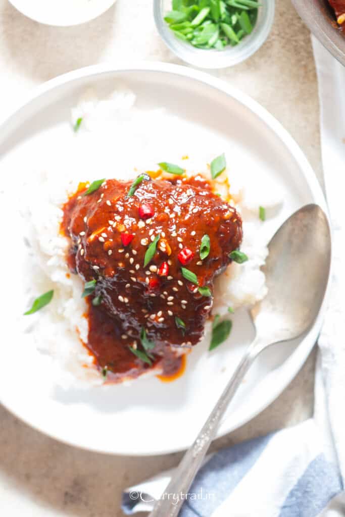 gochujang chicken served with sushi rice in a plate.