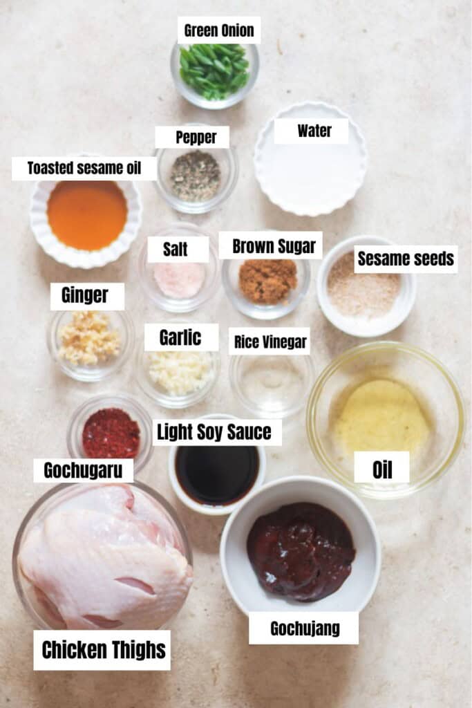 all ingredients for gochujang chicken arranged on a table.