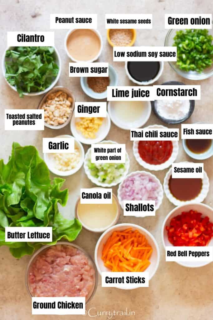 all ingredients for Asian style chicken lettuce wraps arranged on a table.