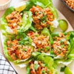 Lettuce cups filled with Asian ground chicken filling along with toppings.