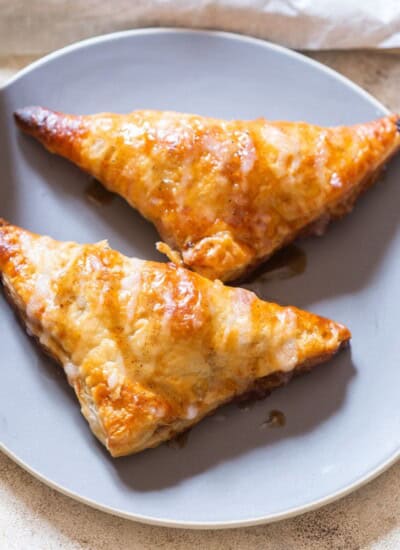 puff pastry filled with cinnamon apples and sugar glaze drizzed on top.