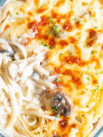 creamy chicken linguine baked with mozzarella cheese in baking dish.