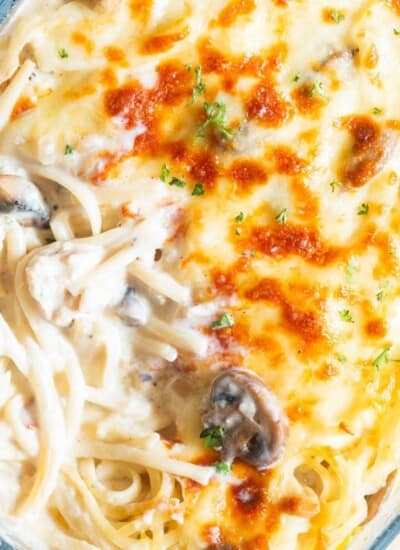 creamy chicken linguine baked with mozzarella cheese in baking dish.