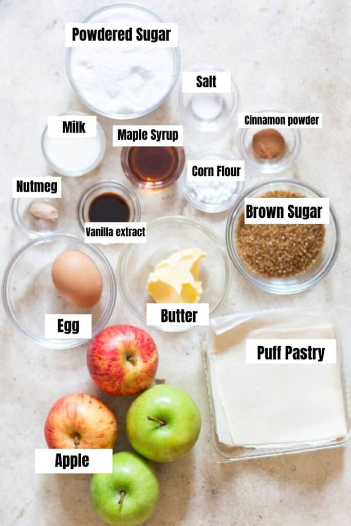 all ingredients for apple tunrovers with puff pastry arranged on the table.