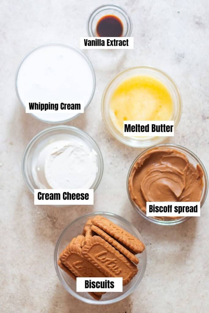 All ingredients for no bake cheesecake arranged on a table.